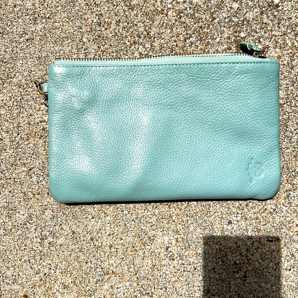 HButler light blue wristlet with charging port.